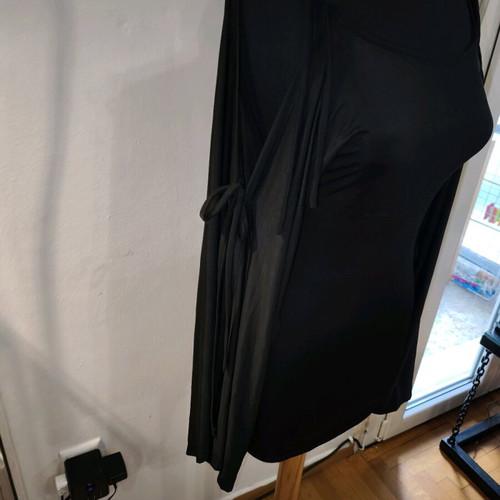 Black asymmetric top like new with ties and semi-transparent sleeves size M
