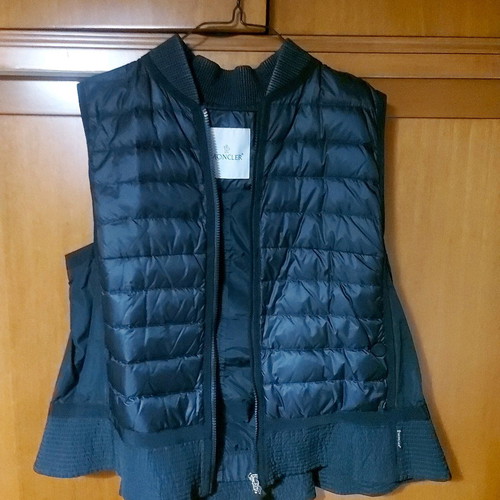 Moncler sleeveless vest used with pleat detail at back, black