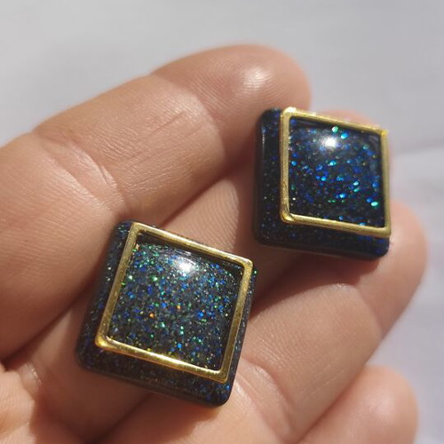 Handmade geometric earrings with blue glitter resin