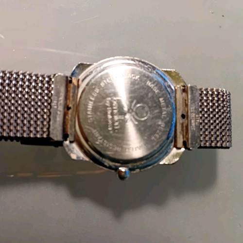 Beneton by Bulova watch used unisex with world map dial and metal mesh bracelet vintage collectible 1980-1990