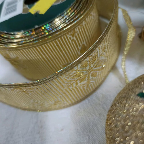 Christmas decorations like new, assorted ornaments and ribbon
