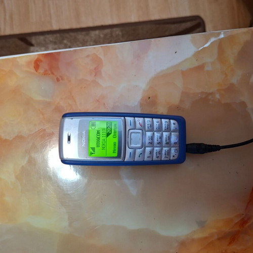 Nokia 1110i used, gray phone with charger