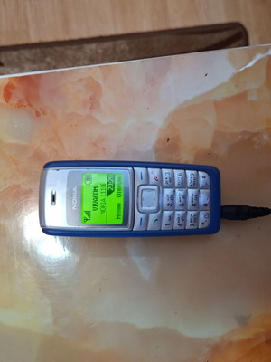 Nokia 1110i used, gray phone with charger