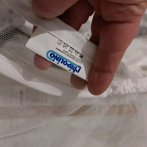 Chipolino gray baby cot used with Grecostrom mattress and mosquito net