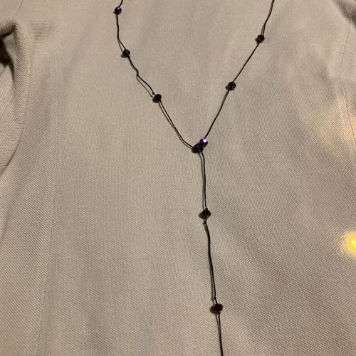 Necklace with purple beads like new, long with black cord