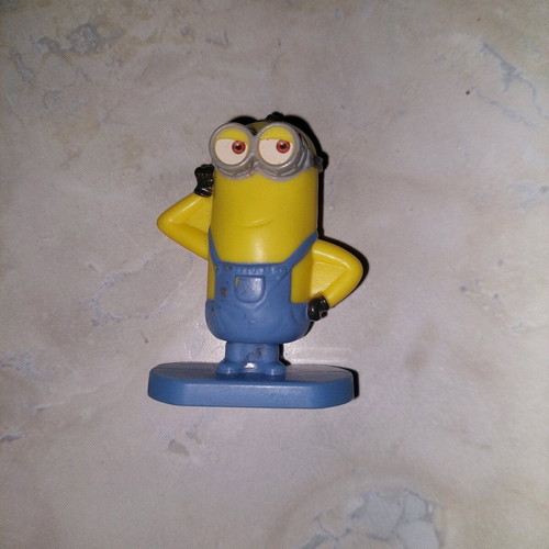 Minion figure with rotating base like new