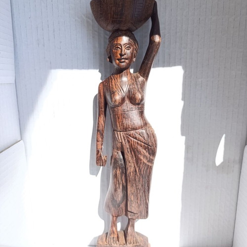 Rosewood figure of woman with basket from Bali, like new