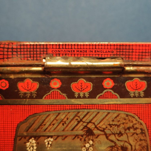 Vintage collectible metal biscuit tin used with Japanese motifs