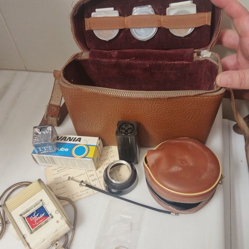 Vintage camera accessories in leather case used