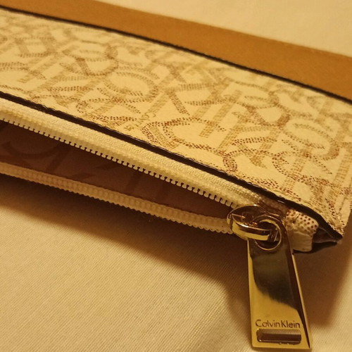 Calvin Klein Monogram Wristlet pouch cream and tan, like new