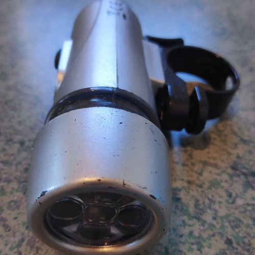 Front LED Bicycle Light used, silver with handlebar mount