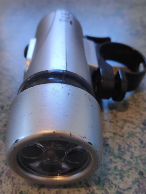 Front LED Bicycle Light used, silver with handlebar mount