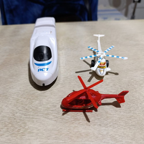 Plastic helicopter and train figures used