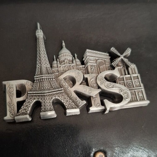 Metal souvenir magnet with Paris theme, silver color