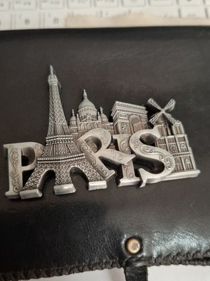 Metal souvenir magnet with Paris theme, silver color