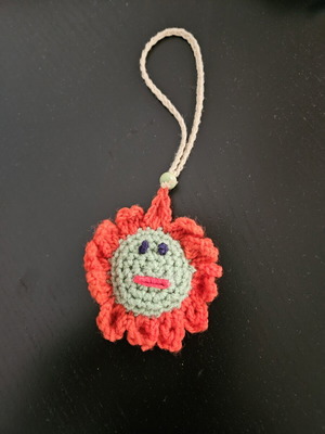 Handmade crochet flower charm decoration