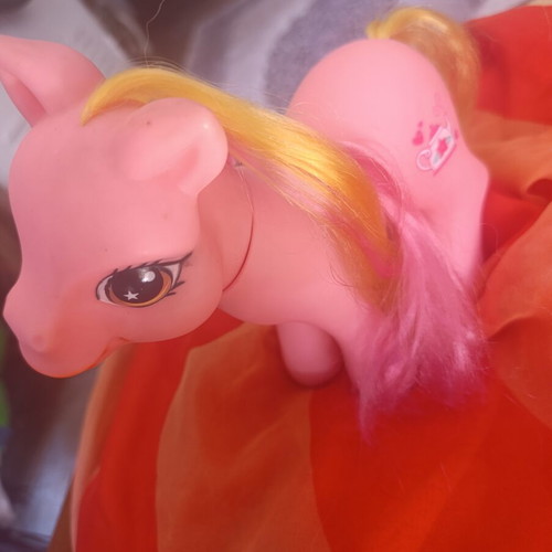 Large pink pony toy with colorful mane and tail