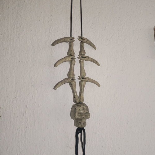 Halloween hanging decoration used with bone and skull appearance
