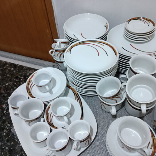 Porcelain set like new, 17 fruit plates, 12 dinner plates, 12 soup plates, 6 tea cups, 6 Greek coffee cups, 6 Nescafe cups, oval platter