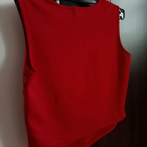 Red sleeveless top with ethnic geometric motifs, like new