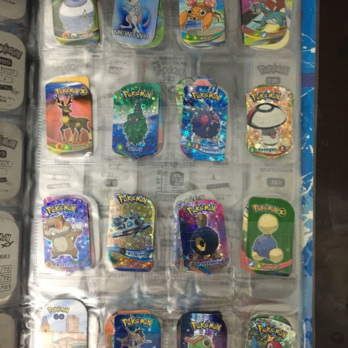 Pokémon album with metal tags used