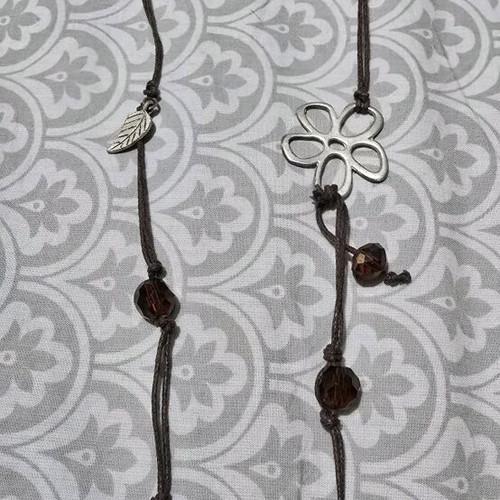 Necklace with beads and silver designs like new, brown and silver