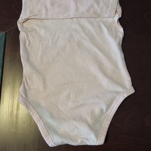 Baby set like new with pink long-sleeve bodysuit and 2 pairs of socks