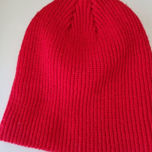 Knitted hat in bright red