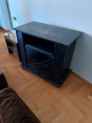 TV cabinet used with glass doors and wheels, top shelf with drawer