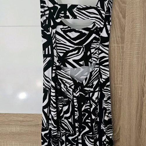 Zebra dress with open back and patterns, size M, like new