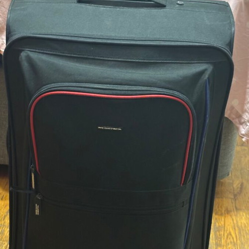 Benetton fabric black suitcase used with two wheels