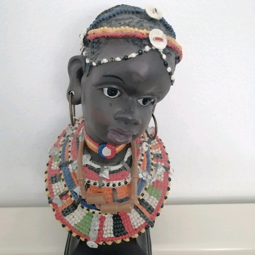 African figurine like new with intricate bead jewelry