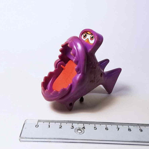 Plastic toy purple fish used with closing mouth