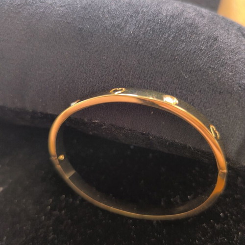 Gold Tone Bangle Bracelet with Hearts and Crystal Details new