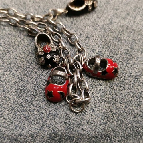 Silver 925 chain with 4 baby shoes used