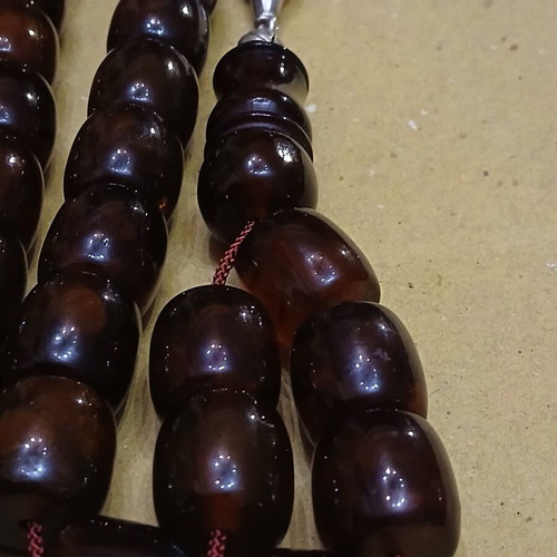 Amber worry beads used with silver elements and tassel