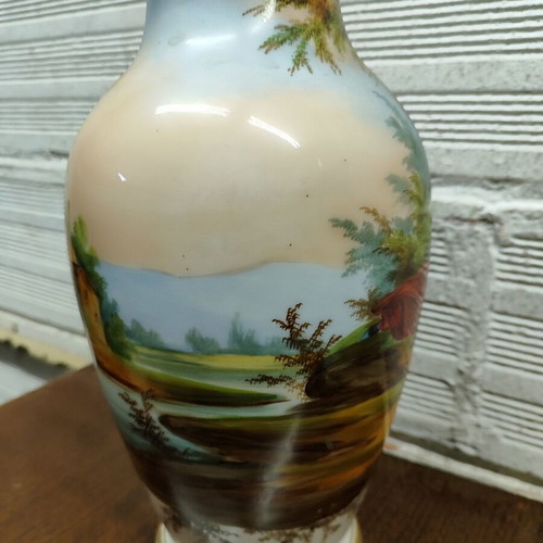 Old porcelain vase used, hand-painted with romantic scene