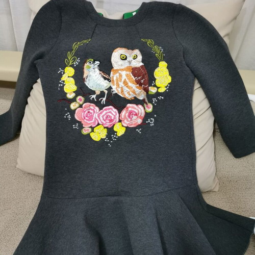 Elegant women's dress with peplum hem and embroidery