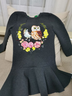 Elegant women's dress with peplum hem and embroidery