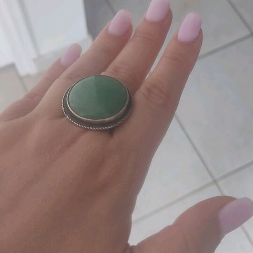 Silver round ring with green stone used, adjustable