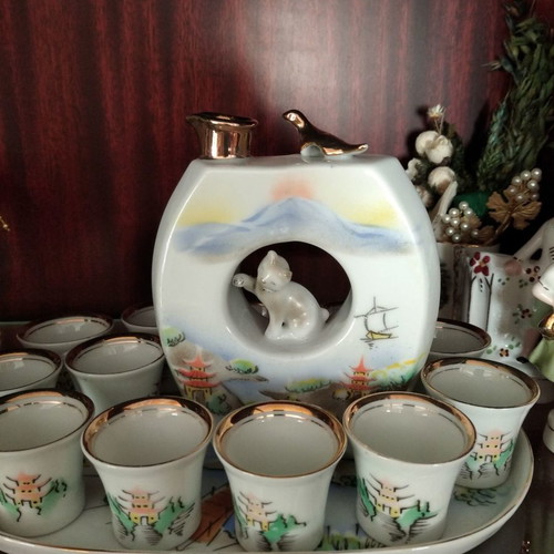 Japanese porcelain sake set used, 12 cups and carafe with tray