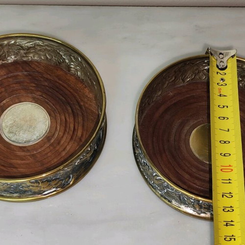 Wine Coasters used, silver metal with wooden base, repoussé grape motif