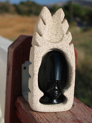 Obsidian African face sculpture