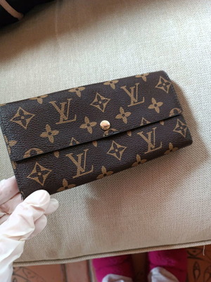 Louis Vuitton wallet like new, brown with edge wear