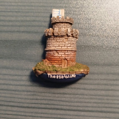 Set of 12 souvenir fridge magnets from various regions