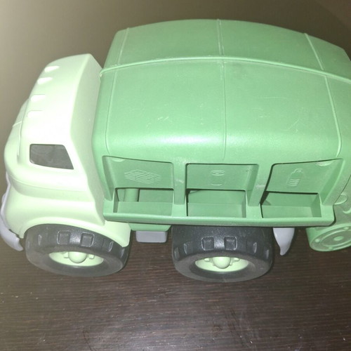 Green toy truck with opening feature