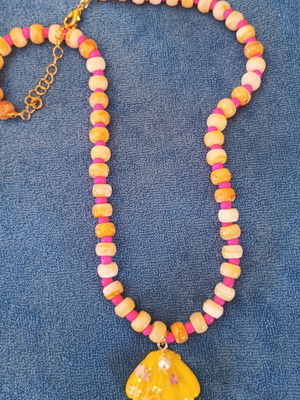 Handmade summer necklace with pink and salmon resin beads and yellow shell