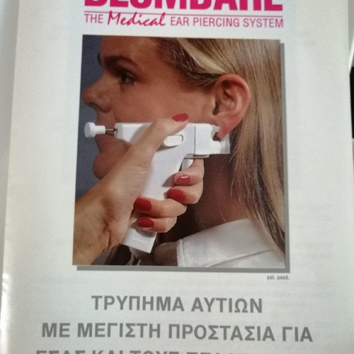 Ear piercing machine used with 2 replacement needles