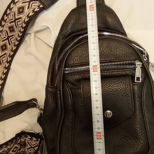 Black Sling Bag Crossbody backpack like new with wide strap and multiple pockets