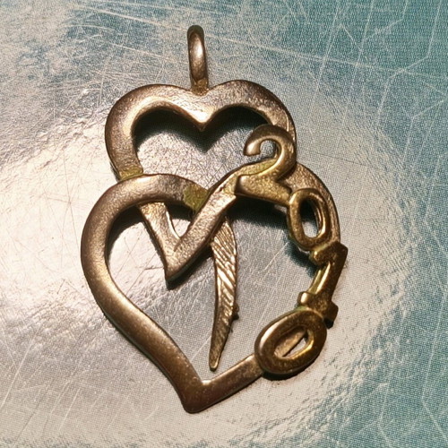 Silver necklace with two hearts and 2010 date used